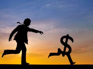 man chasing money